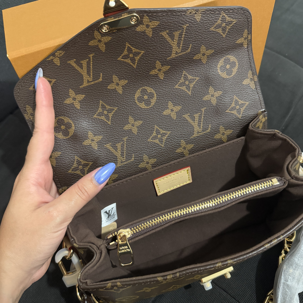 Cartera pochette metis LV