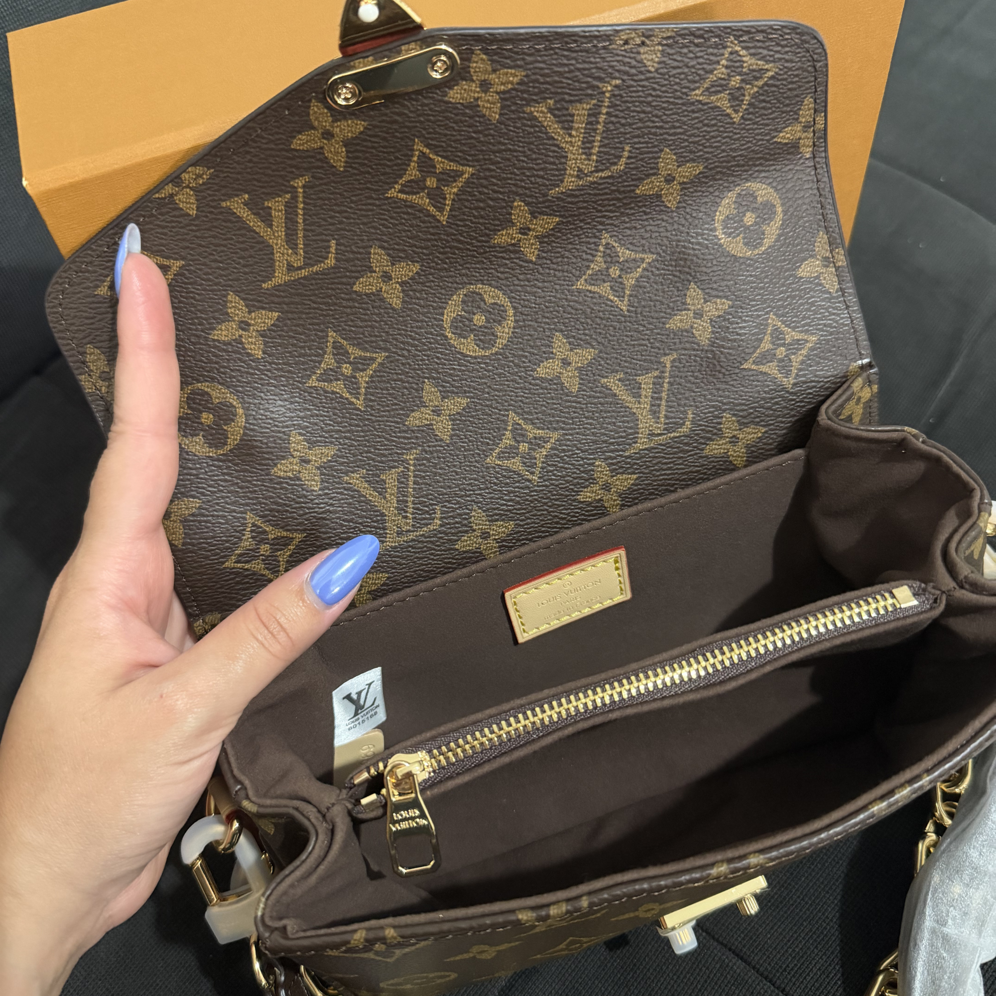 Cartera pochette metis LV