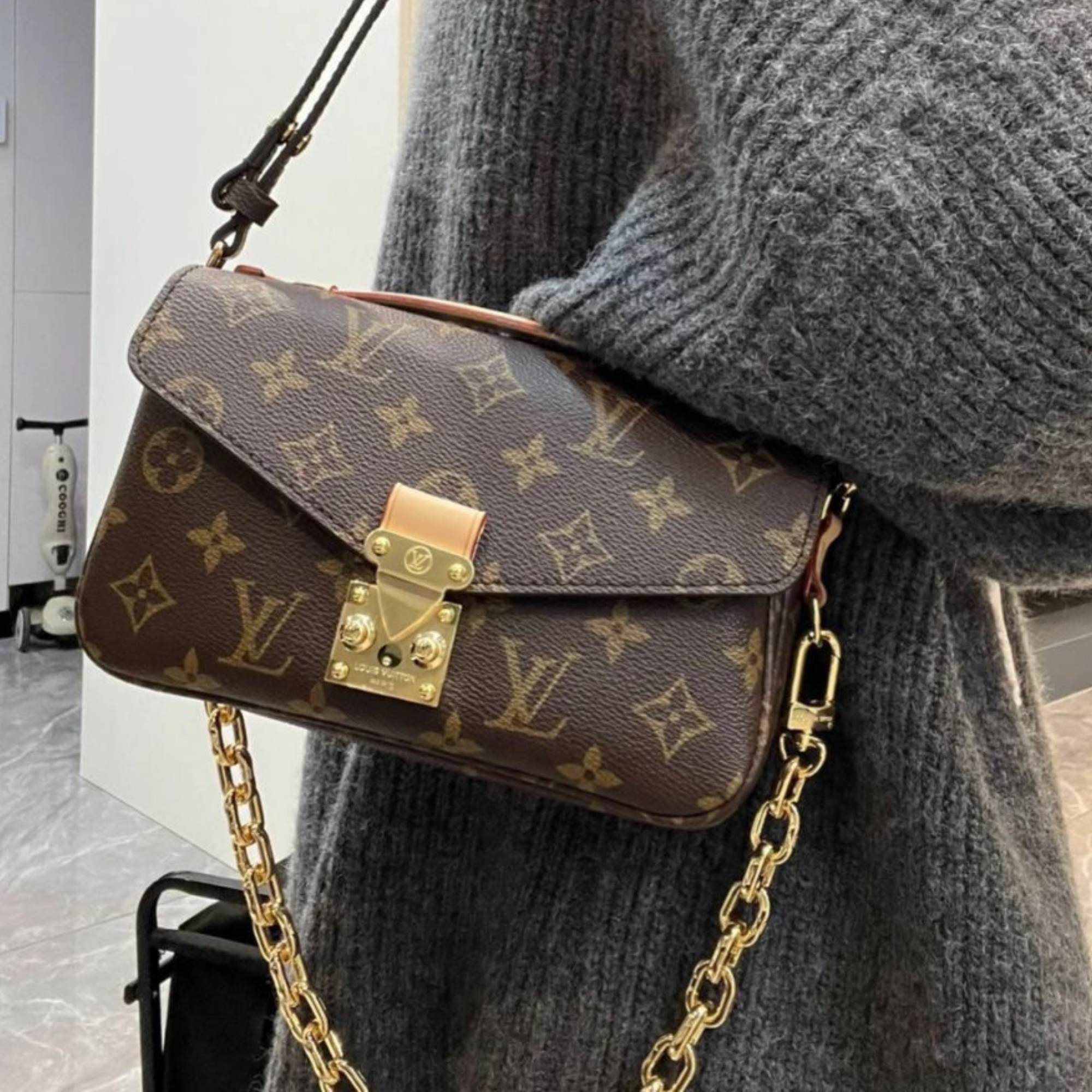 Cartera pochette metis LV