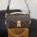 Cartera pochette metis LV