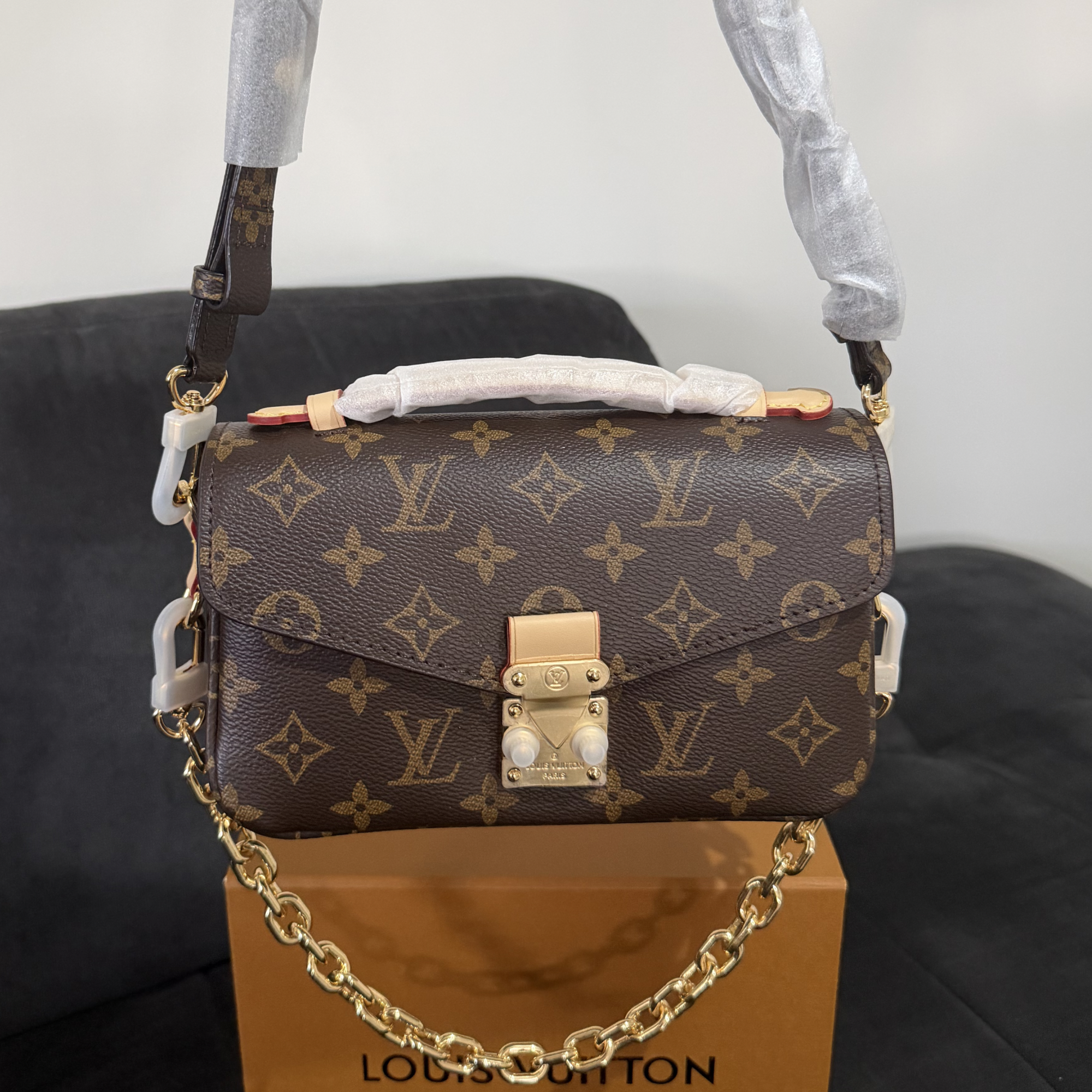 Cartera pochette metis LV